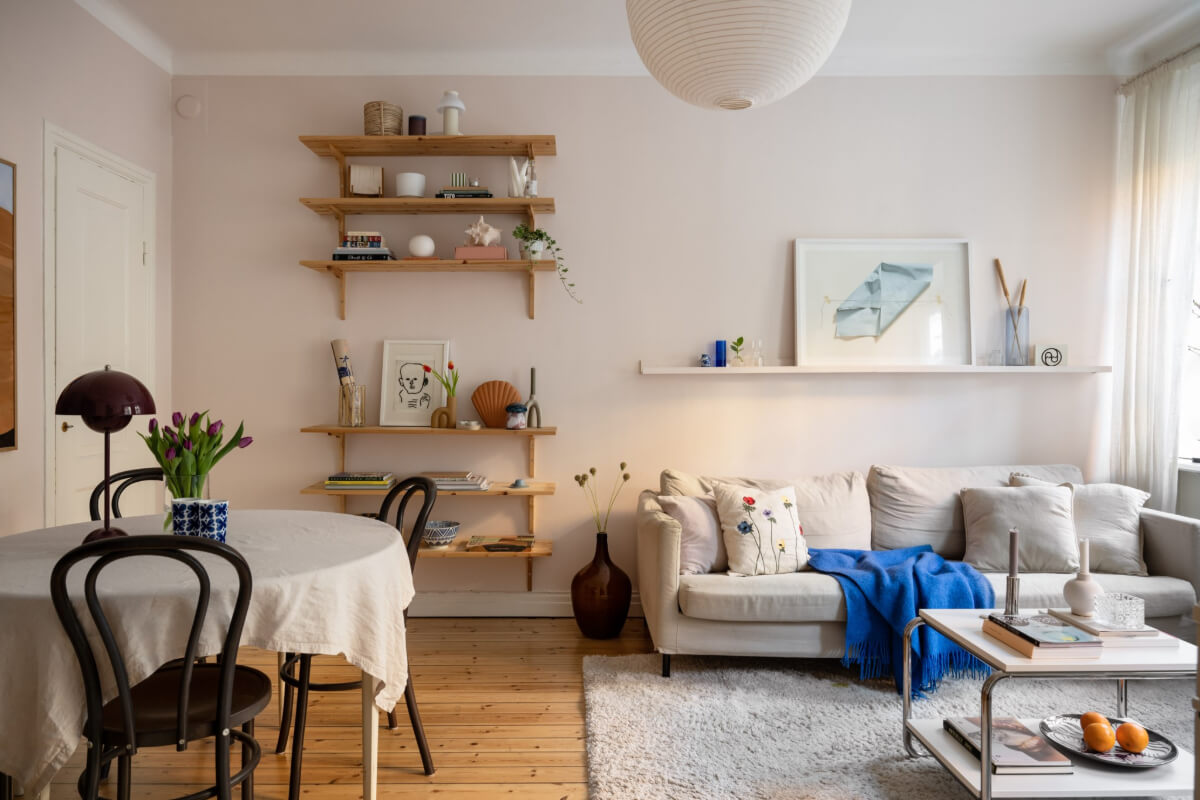 light pink living room bookshelves