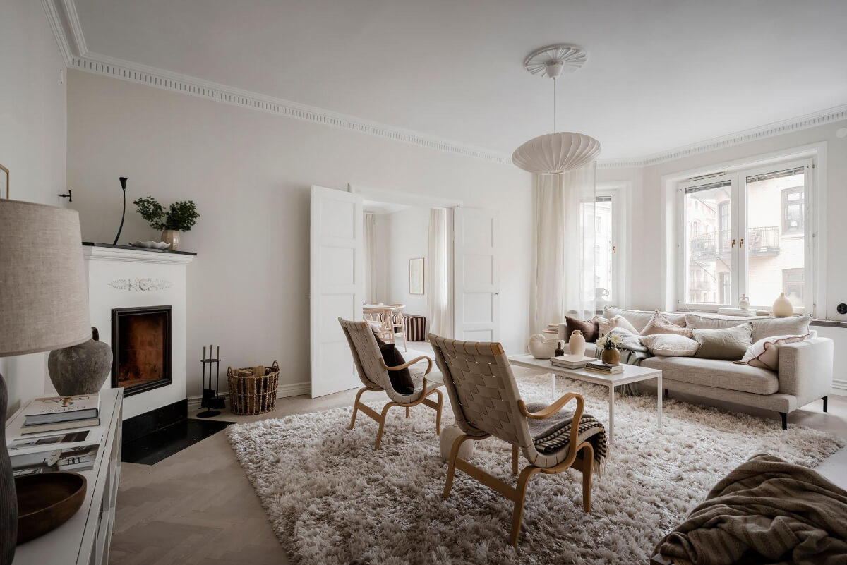 light swedish living room large rug fireplace