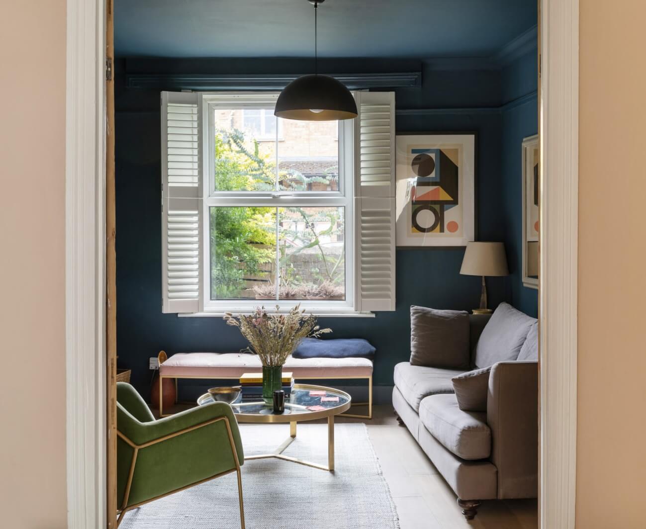 living room dark blue walls nordroom