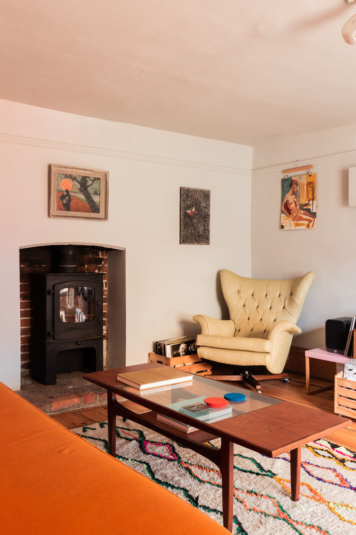 living room woodburning stove colorful rug
