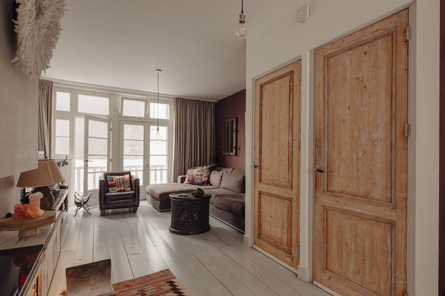 living room wooden floorboards raw wooden doors