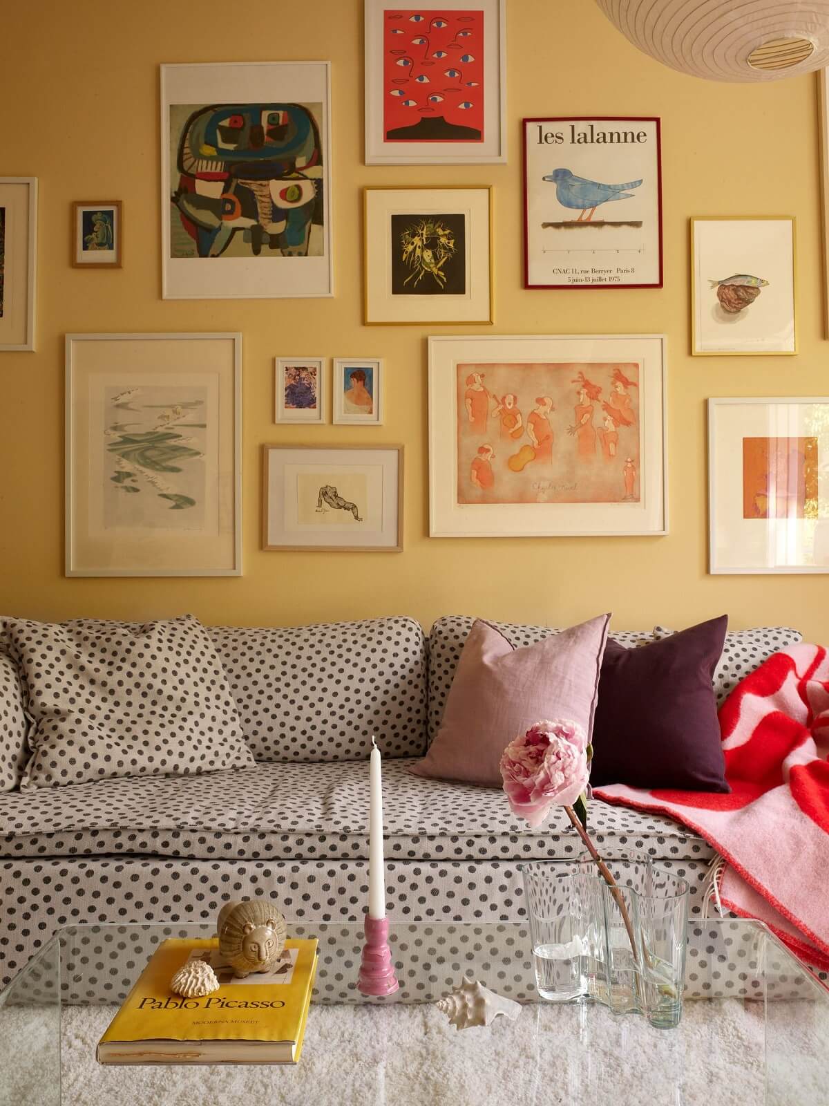living-room-yellow-walls-gallery-wall-polkadot-sofa-nordroom