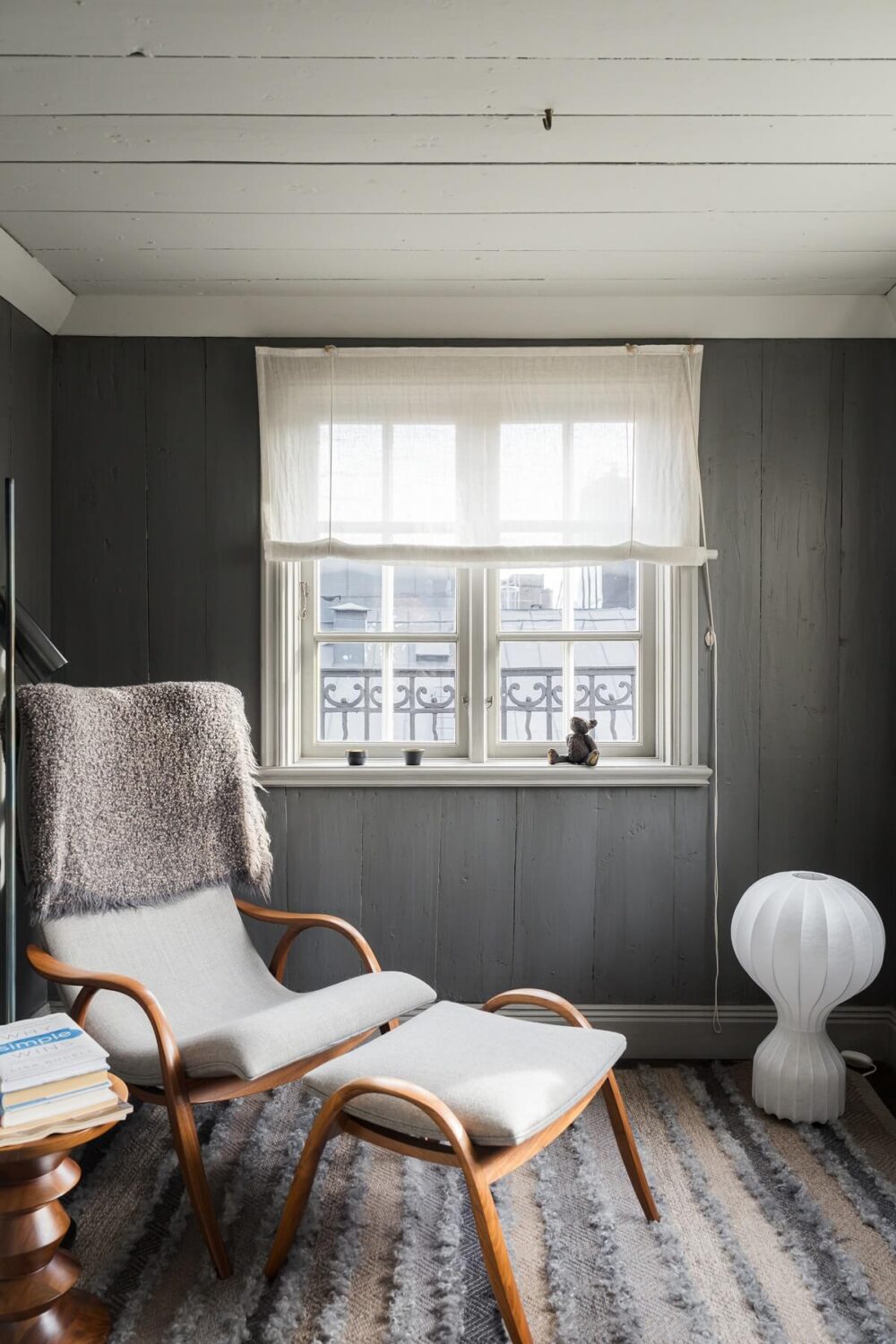 lounge chair gray walls reading nook