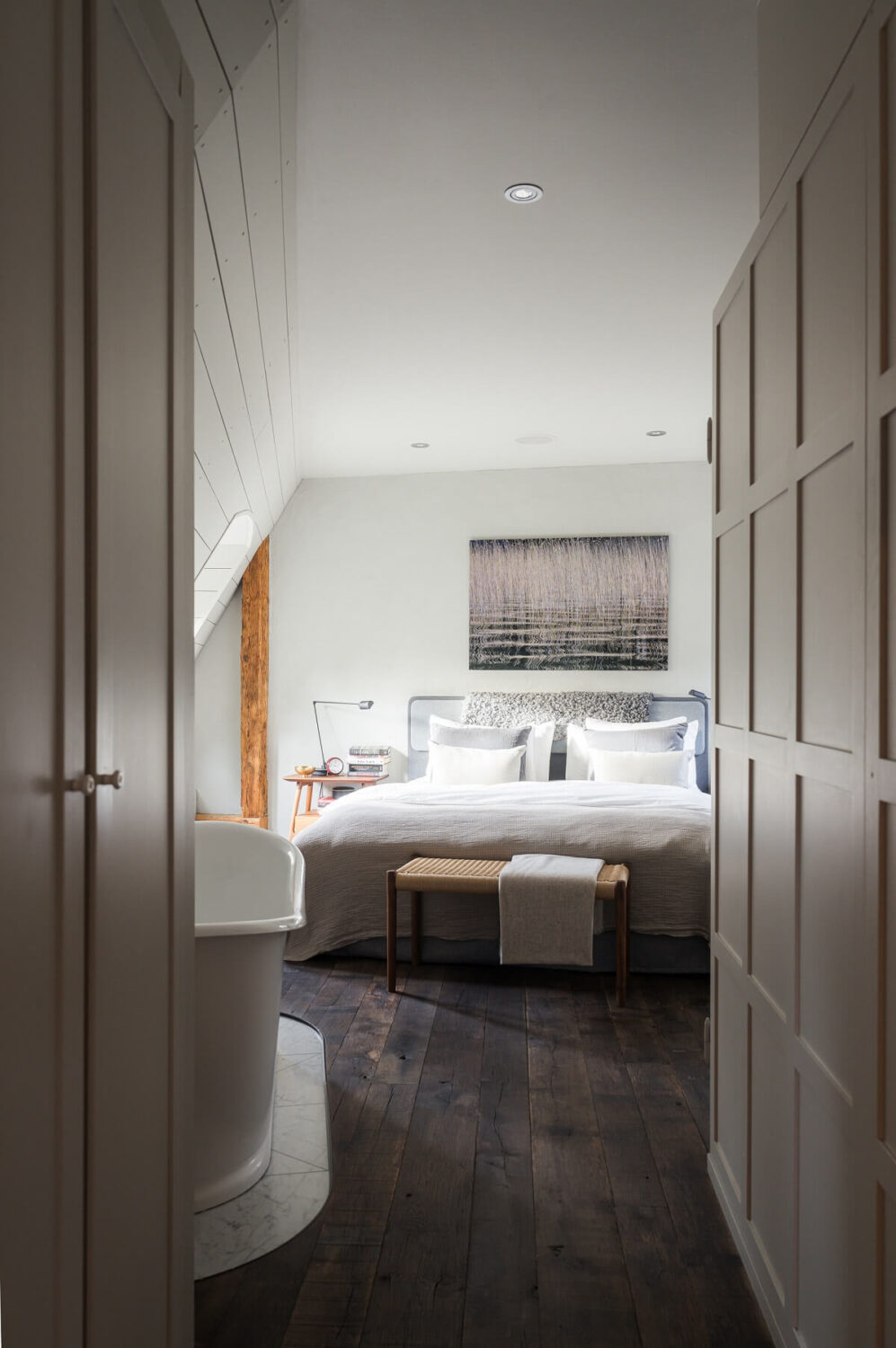 master bedroom wooden floor freestanding bath