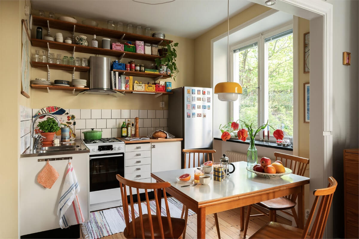 midcentury-swedish-kitchen-beige-walls-formica-table-wooden-shelves-nordroom