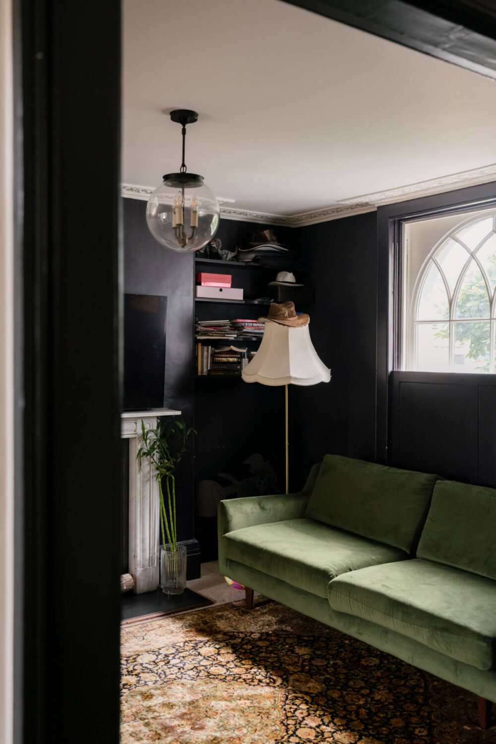 moody sitting room green sofa