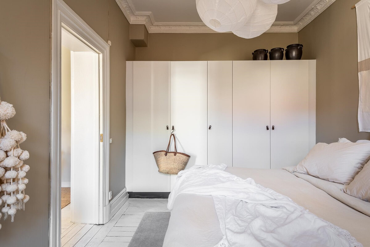 neutral colored bedroom with wardrobes