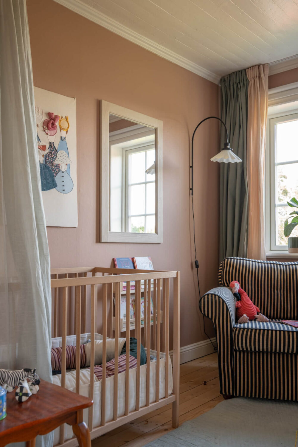nursery with striped chair