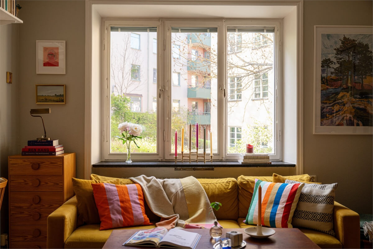 ochre sofa colorful cushions