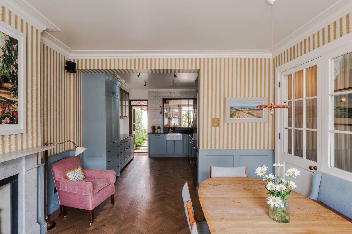 open-plan kitchen dining room striped wallpaper