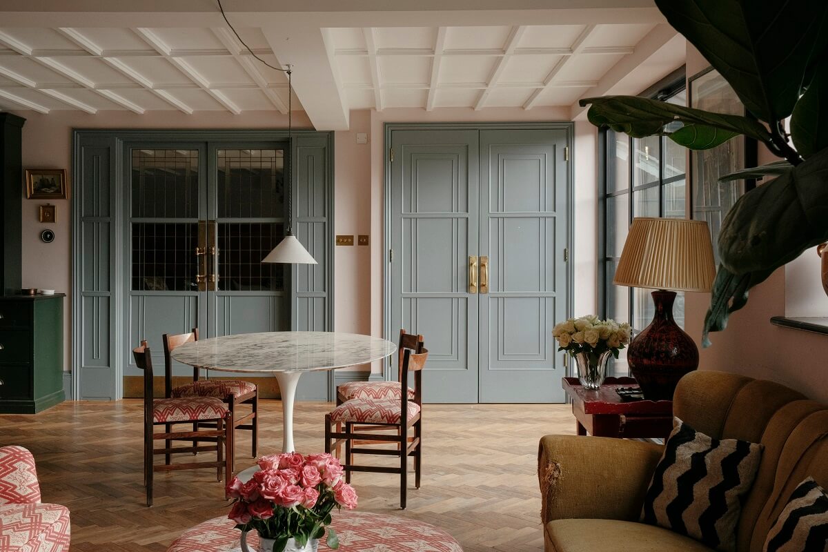 open plan kitchen sitting room with wooden doors