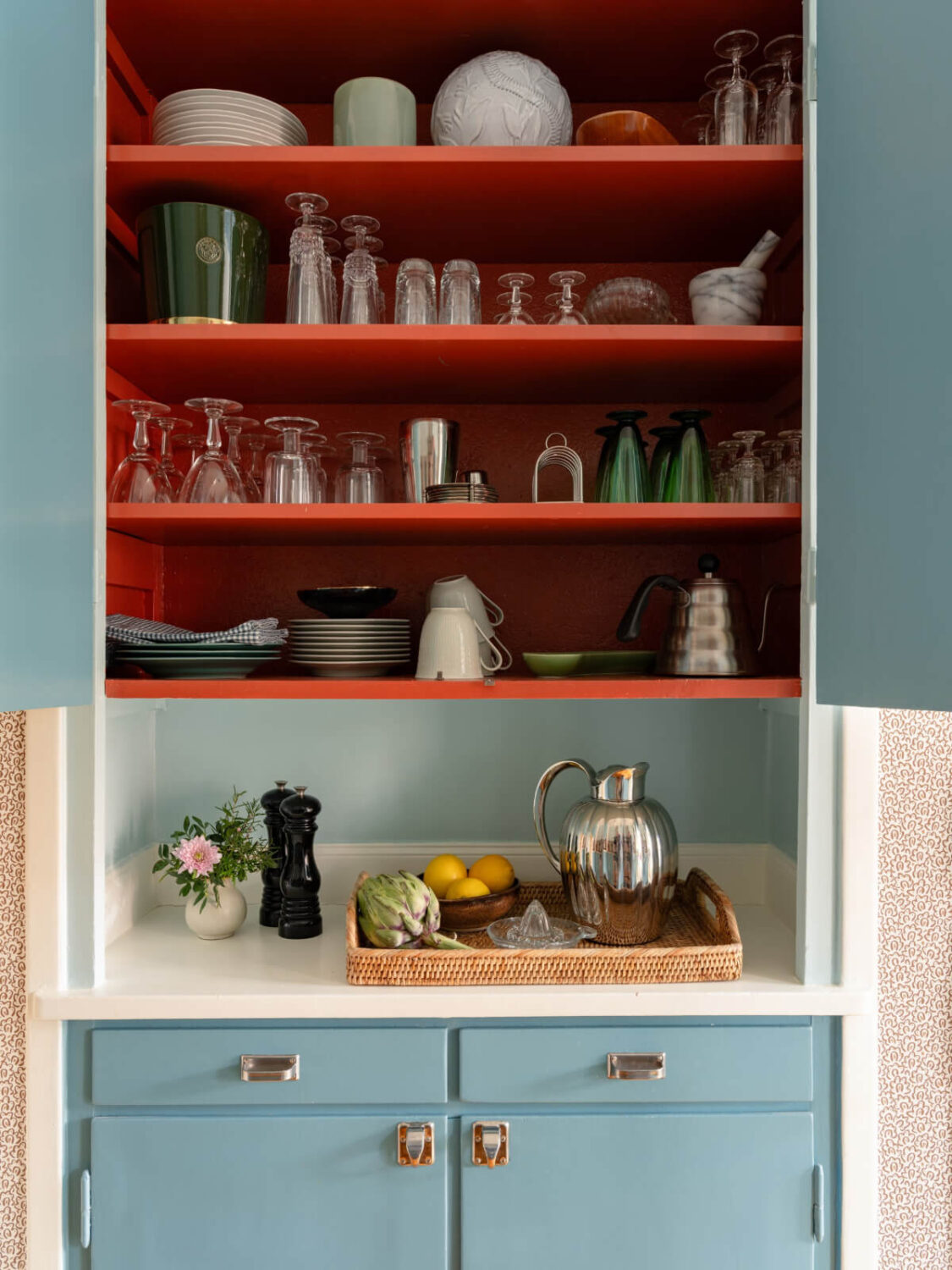 orange painted kitchen cabinet interior