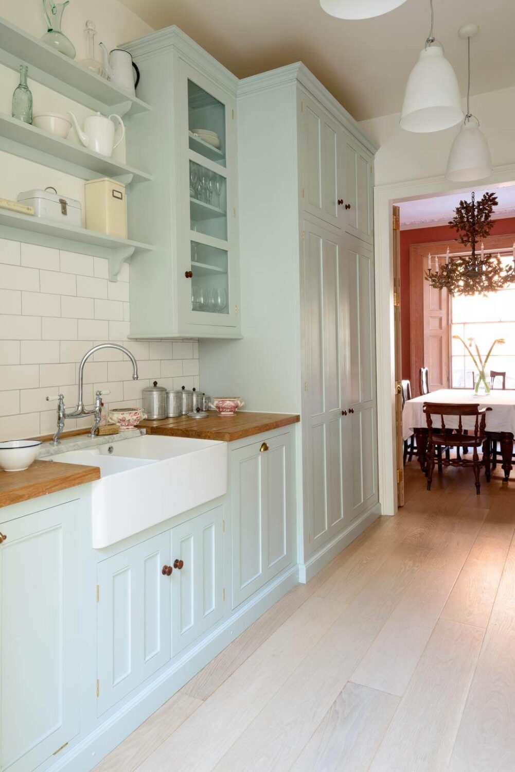 pale blue galley kitchen with wooden countertop nordroom