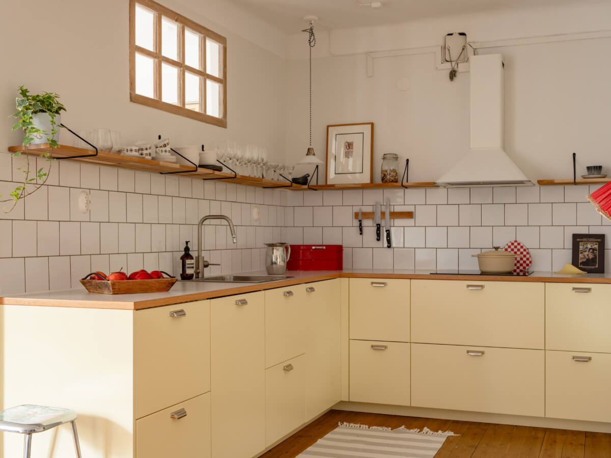 pale yellow kitchen shelf white tiles