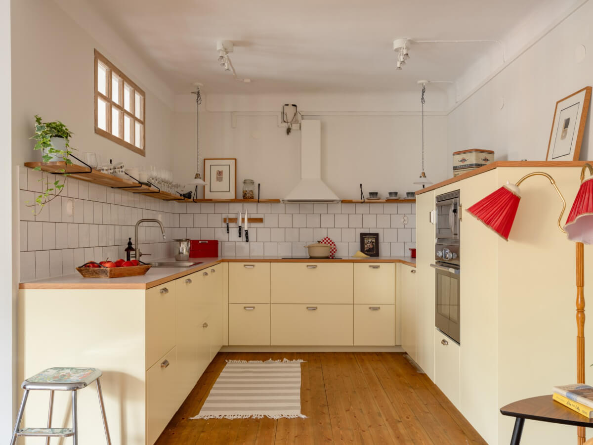 pale yellow kitchen white tiles