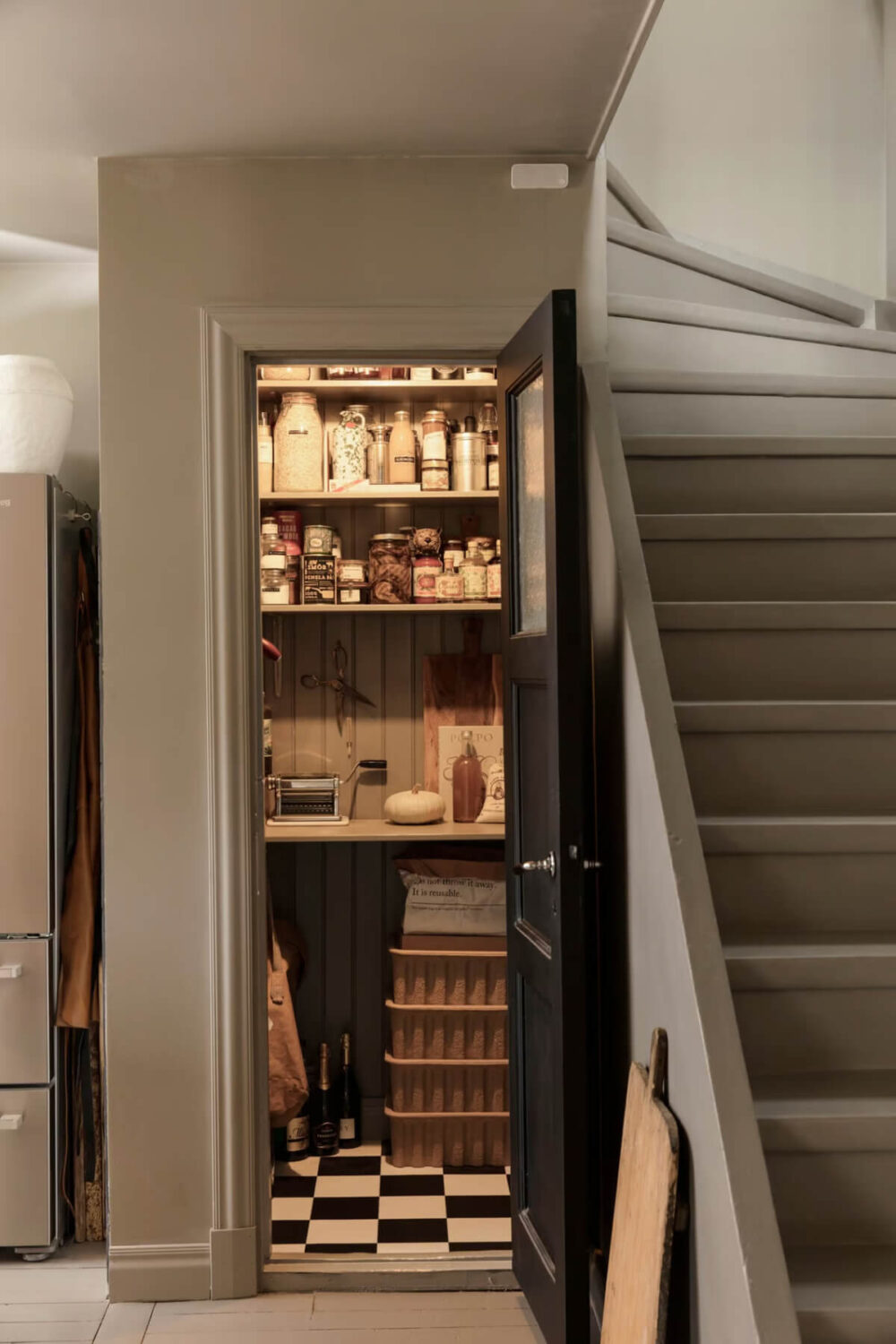 pantry under stairs checkerboard floor nordroom