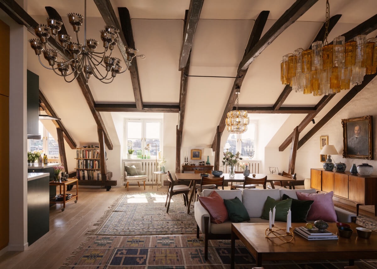 penthouse living space large rugs exposed beams