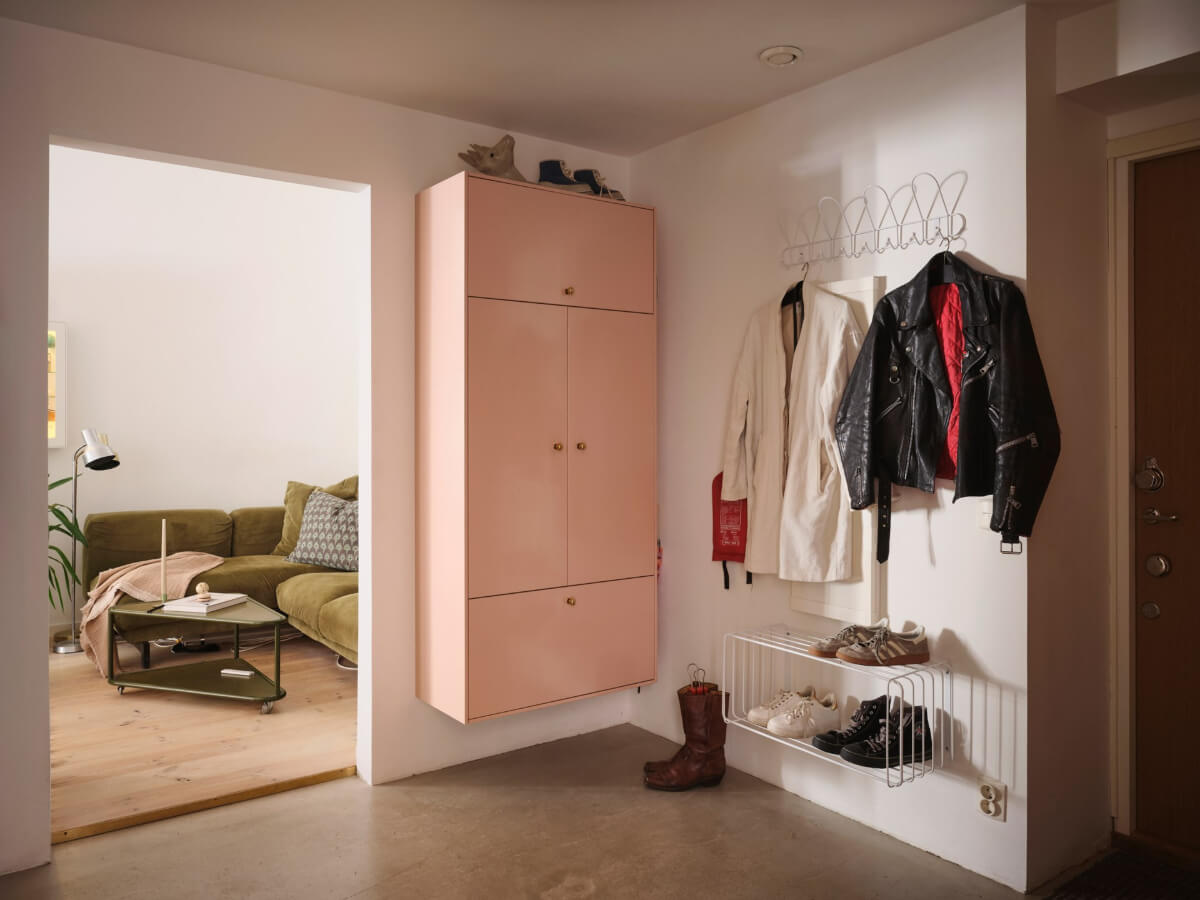 pink floating storage cabinet A Bright Family Apartment in a 1950s School Building