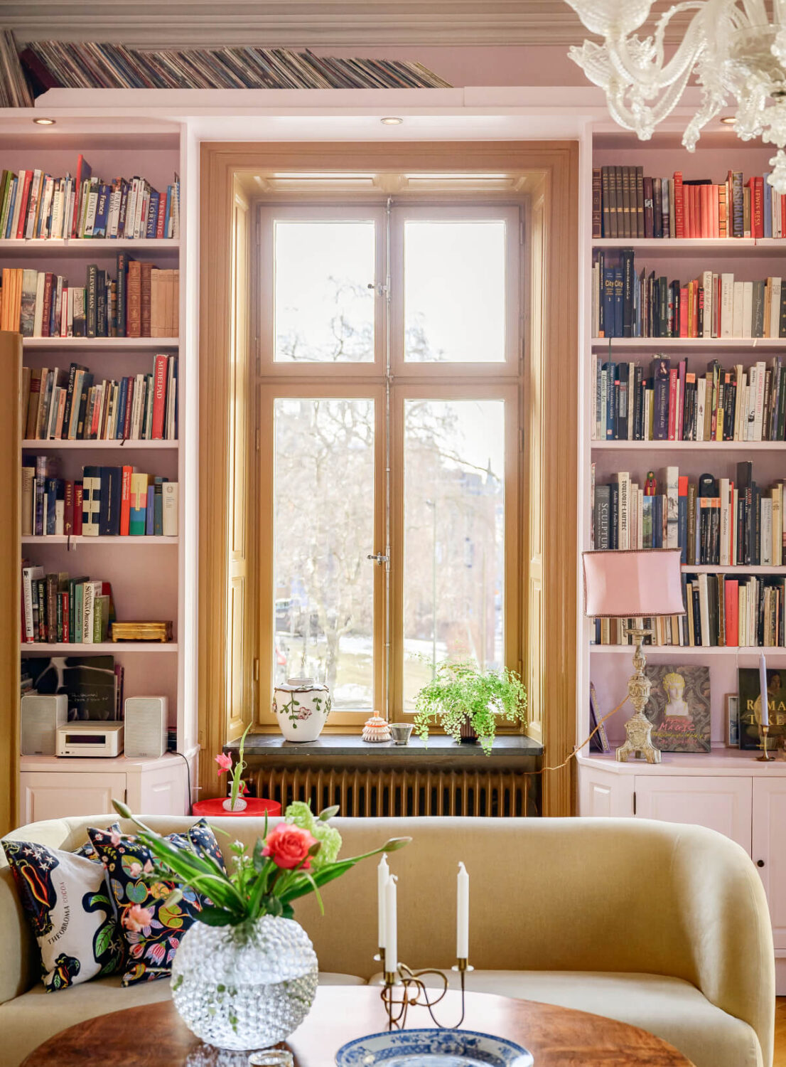 pink living room bookshelves