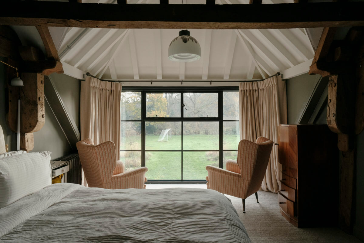 pitched ceiling exposed beams bedroom