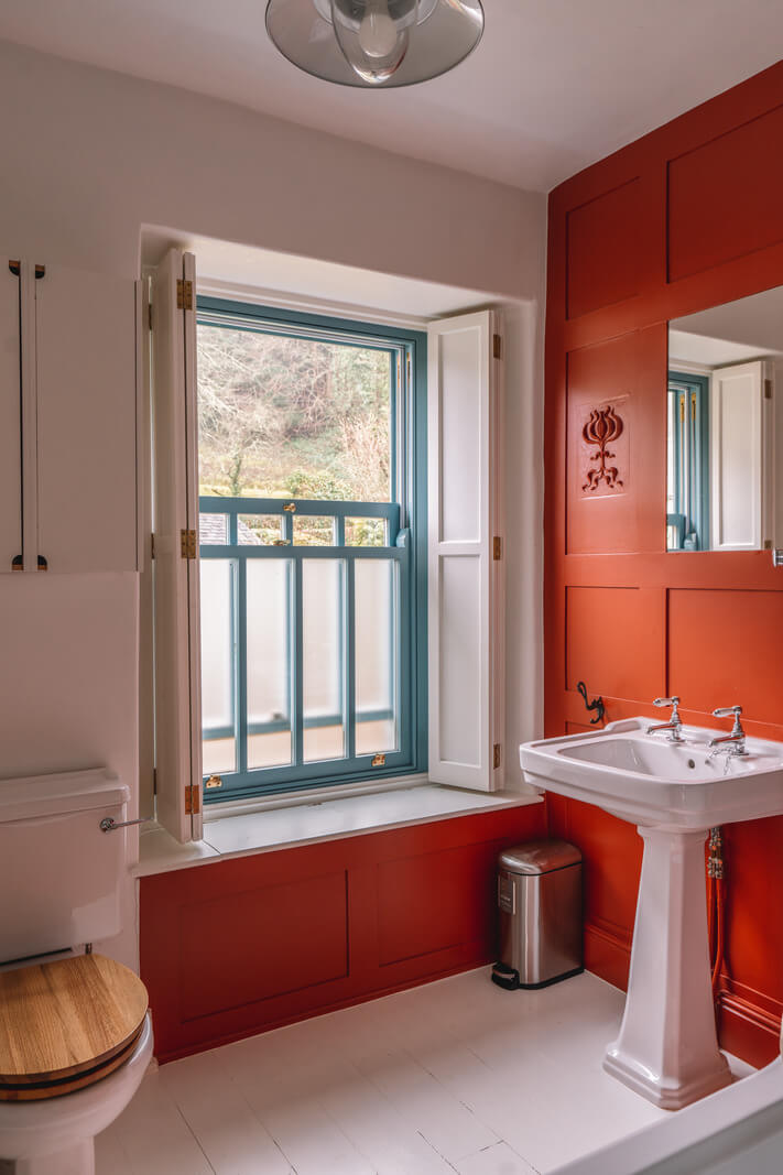 red bathroom white floorboards