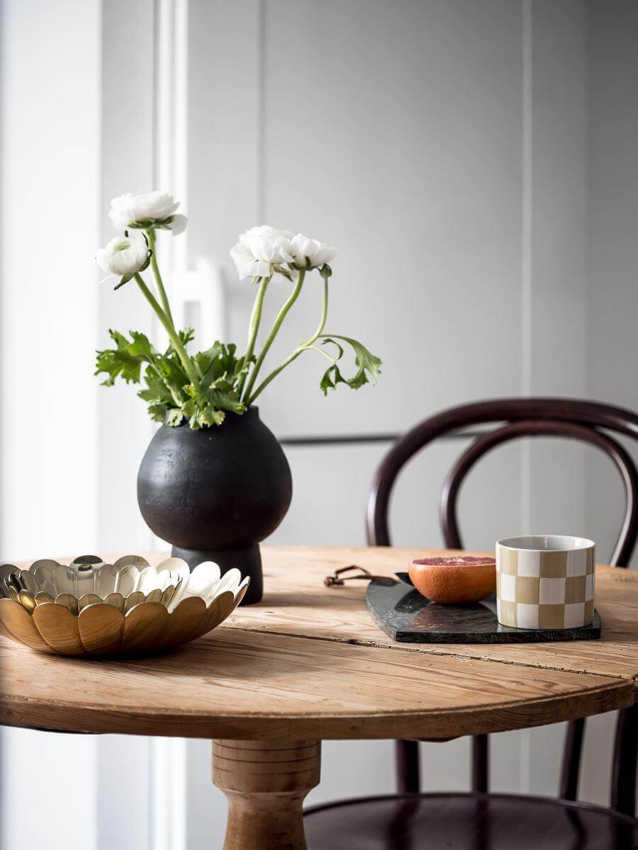 round wooden table with bistro chairs