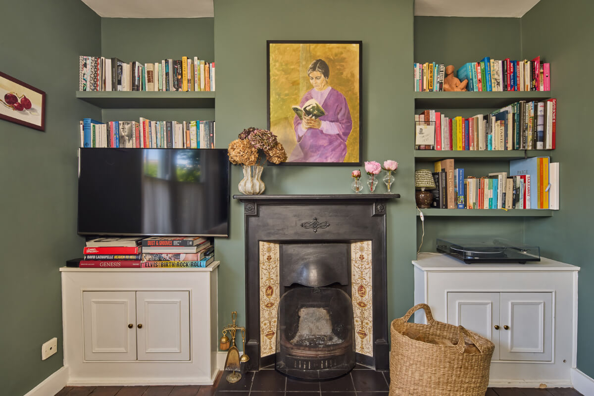 sitting room original fireplace bookshelves