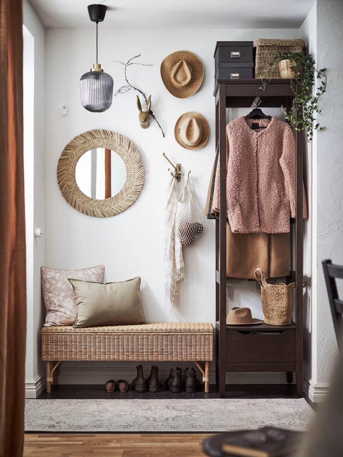 small hallway with bench and high cabinet