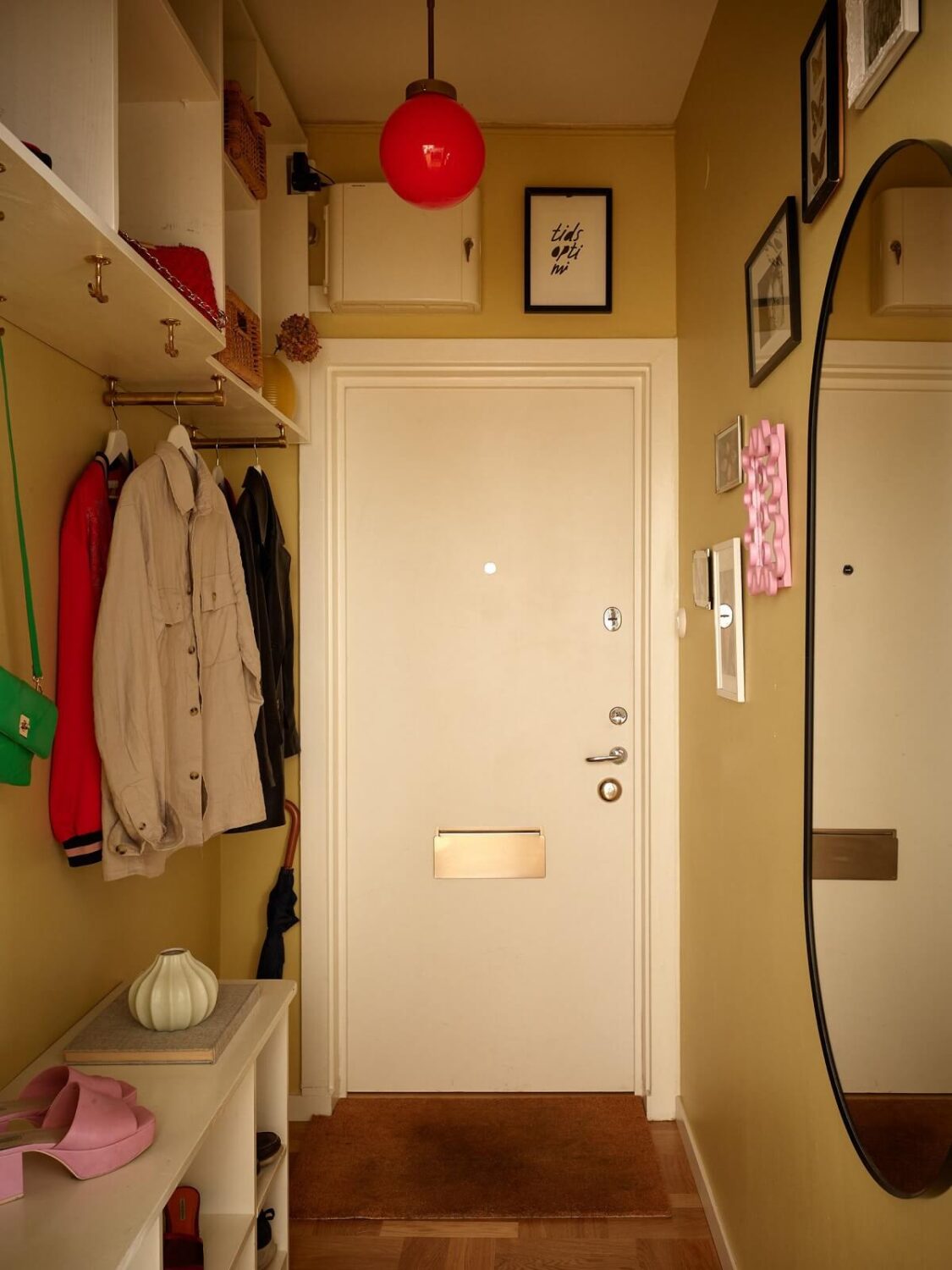 small-hallway-yellow-walls-mirror-built-in-coat-storage-nordroom