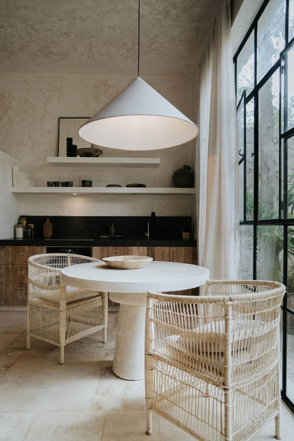 small-round-dining-table-wicker-chairs-airbnb-tulum-mexico-nordroom