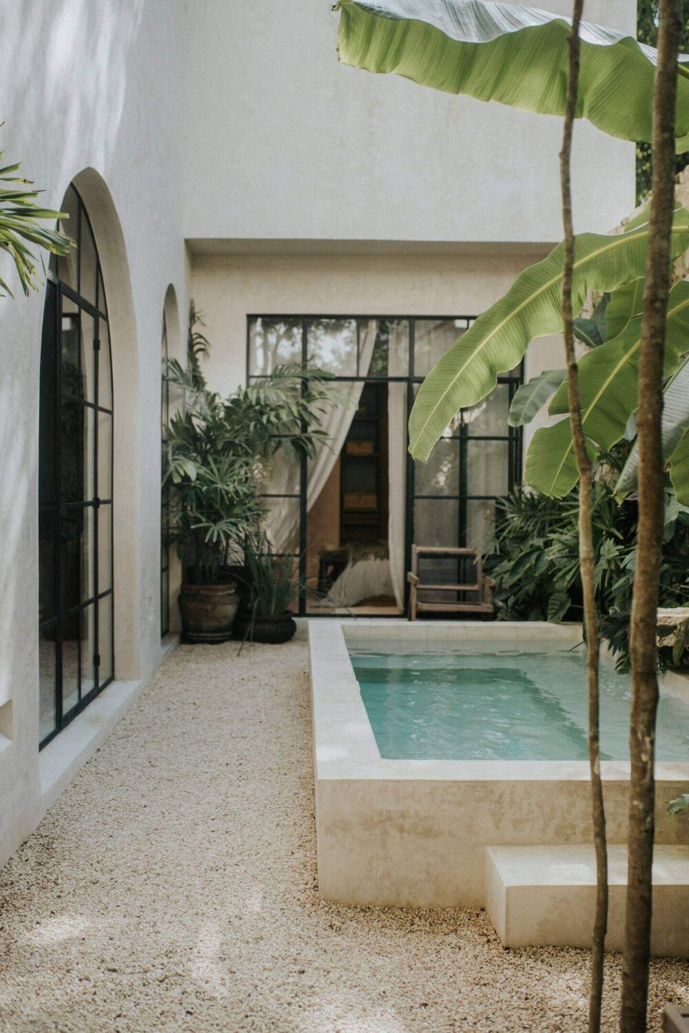 small-swimming-pool-patio-garden-steel-framed-glass-doors-nordroom