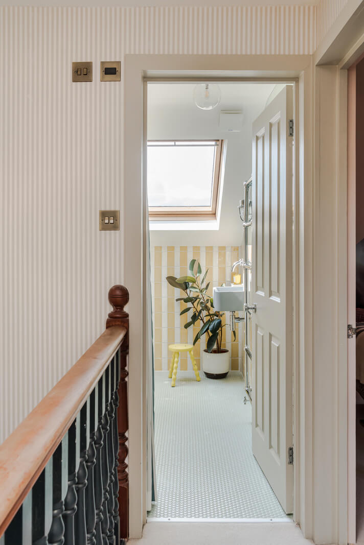 striped hall view into bathroom