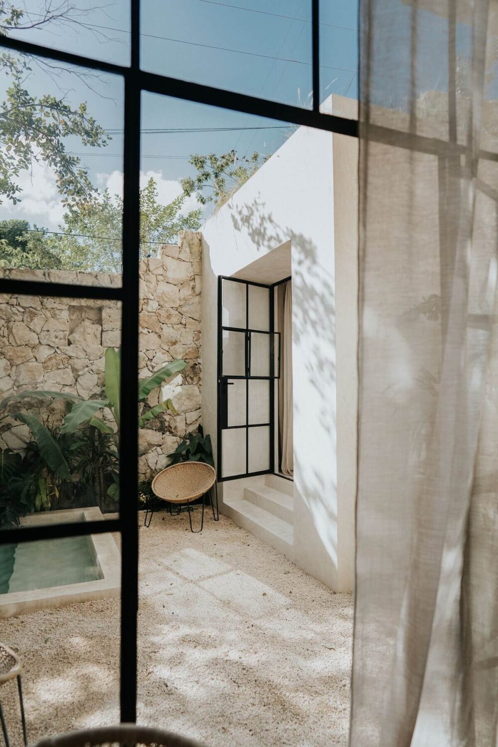 terrace-view-from-bedroom-steel-framed-glass-doors-nordroom