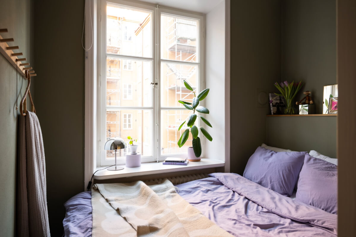 tiny dark green bedroom storage ledge