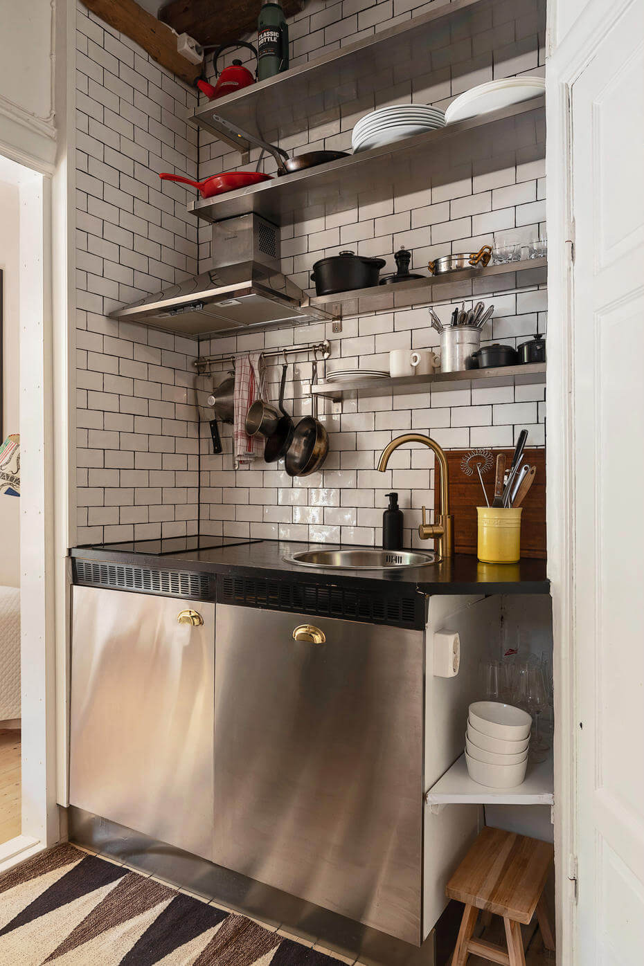tiny stainless steel kitchen white subway tiles wooden beams nordroom