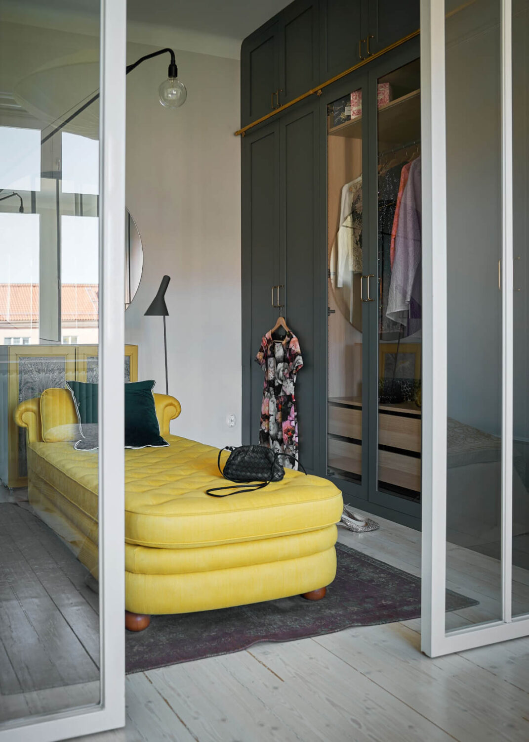 walk in closet blue green wardrobe doors yellow sofa nordroom Behr Color of the Year 2026: Hidden Gem
