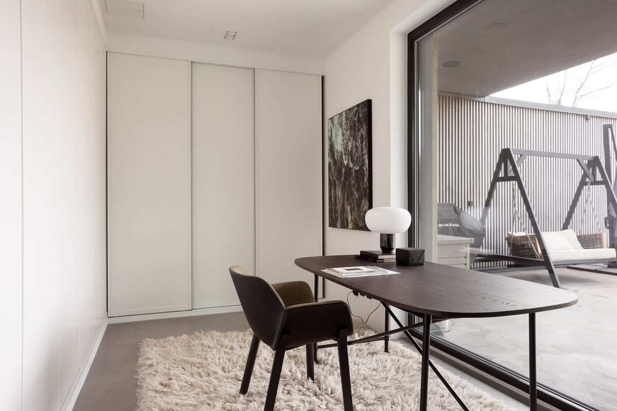 white home office with black desk