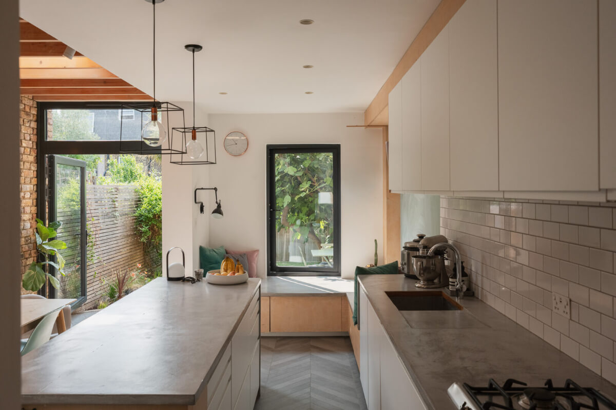 white kitchen concrete worktop window seat bench