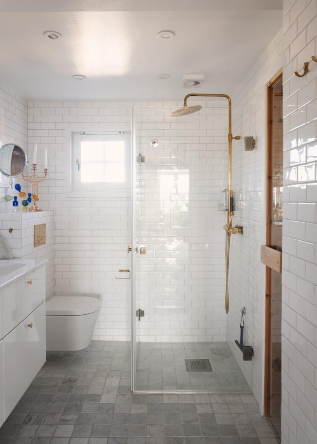 white tiles brass fittings bathroom