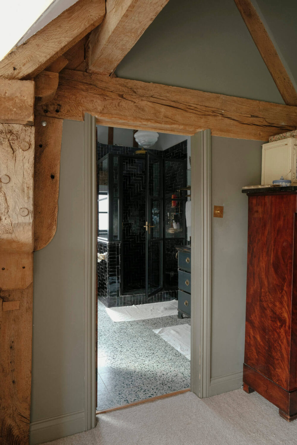 wooden beams and entry to bathroom