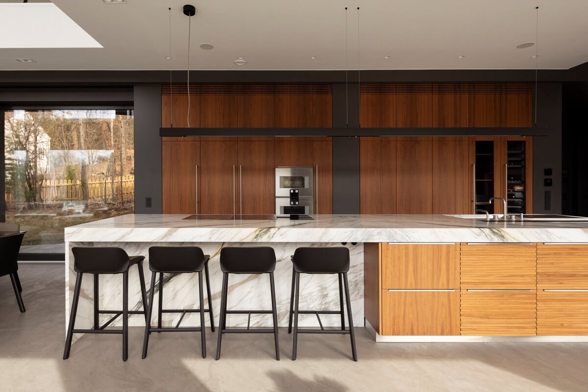 wooden kitchen with marble top and breakfast bar nordroom