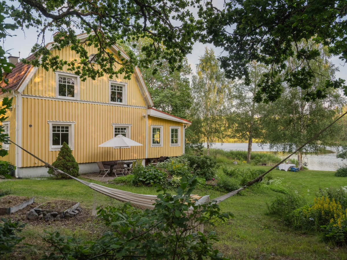 yellow country house with garden sweden