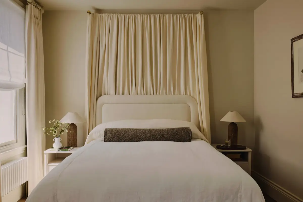 bedroom curtain behind headboard