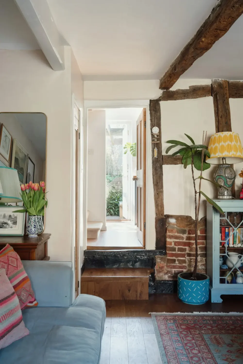 cottage living room exposed brick and beams