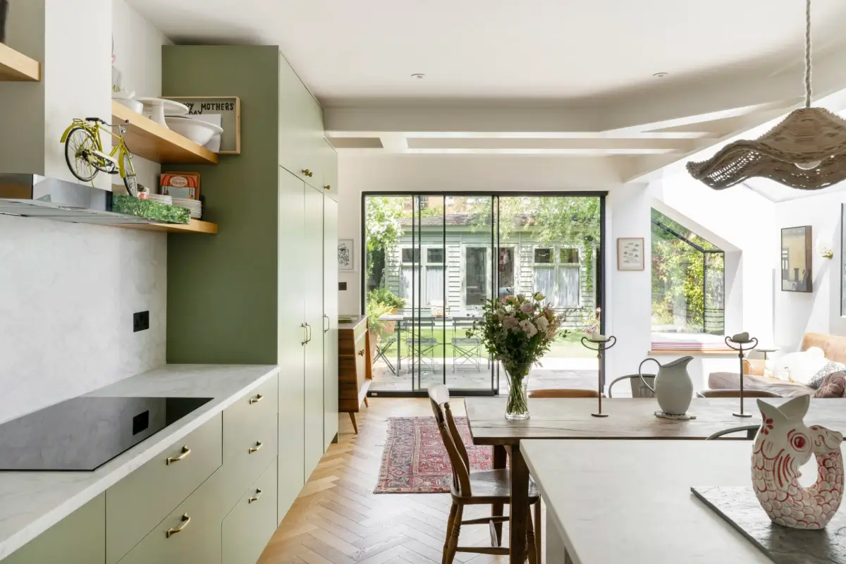 kitchen extension modern green cabinets herringbone parquet floor