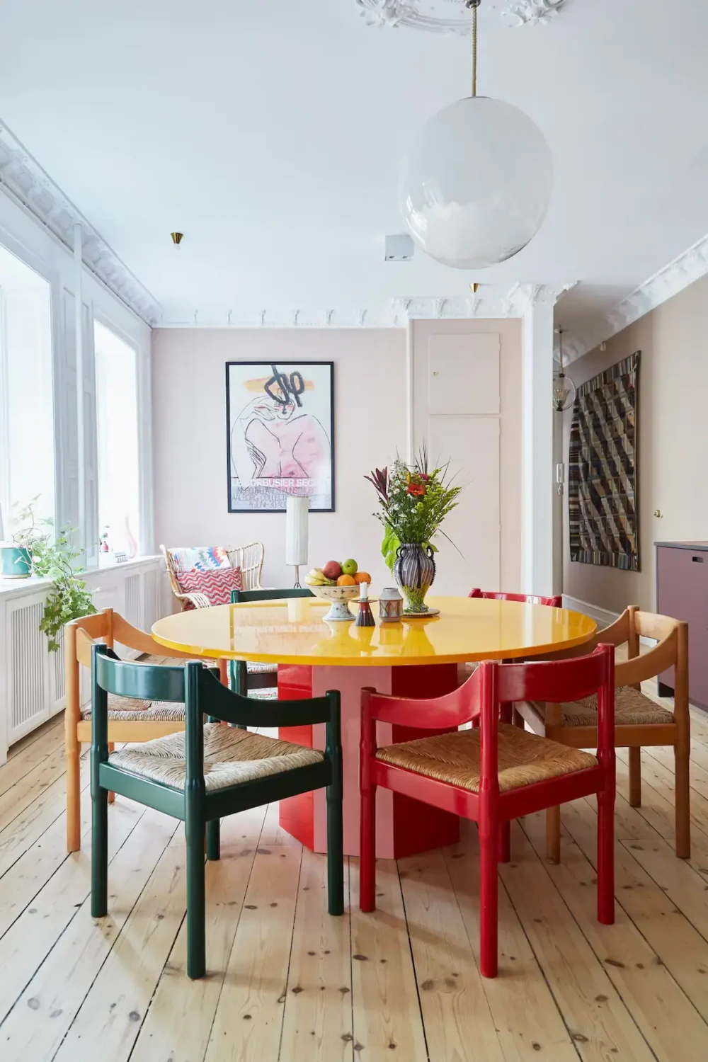 round dining tablewith colorful chairs