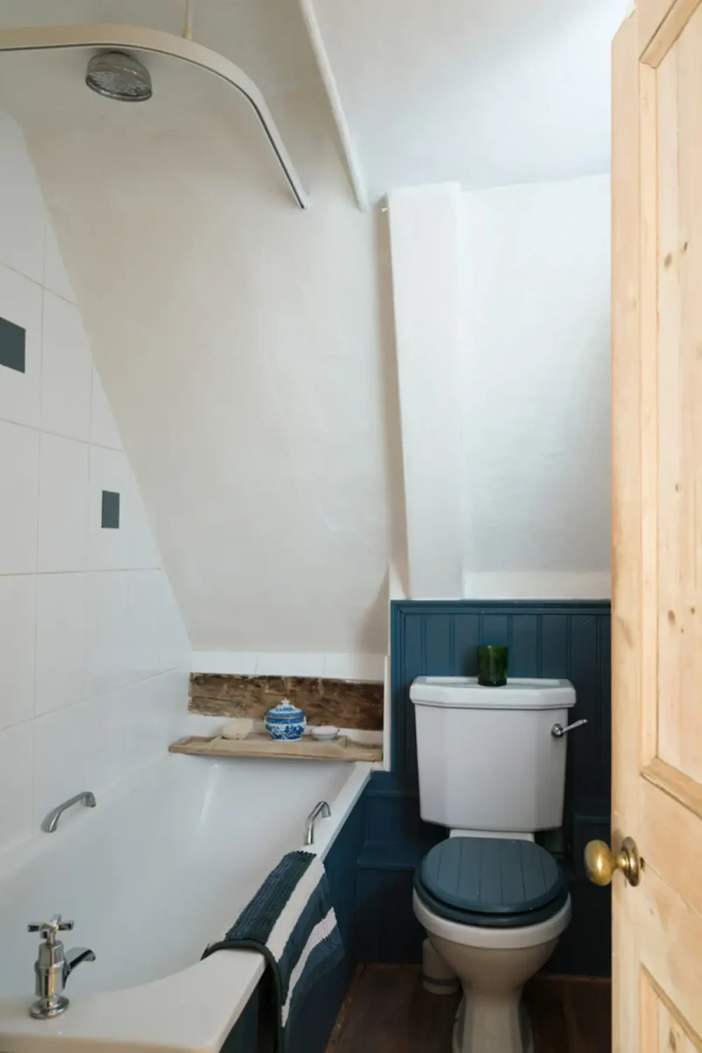 small bathroom blue paneling
