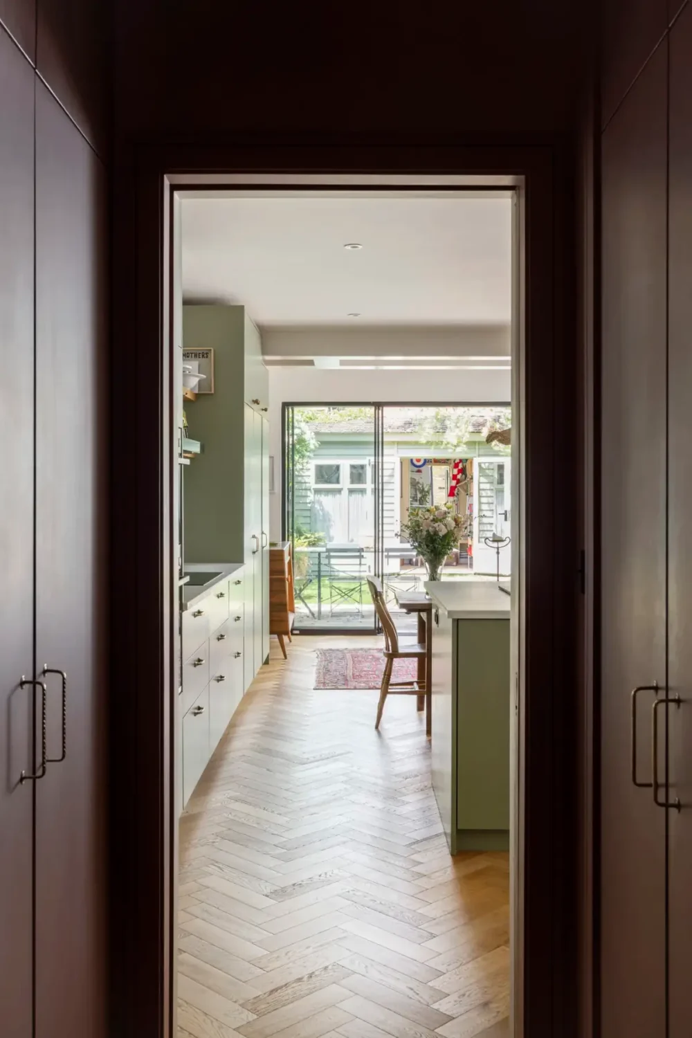 small hall built-in wardrobes green kitchen