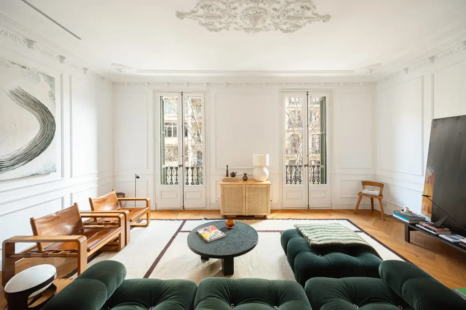 spacious living room period features large green sofa