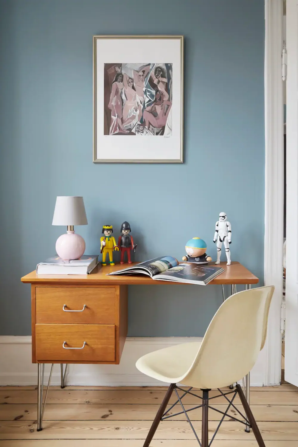wooden desk with light blue wall